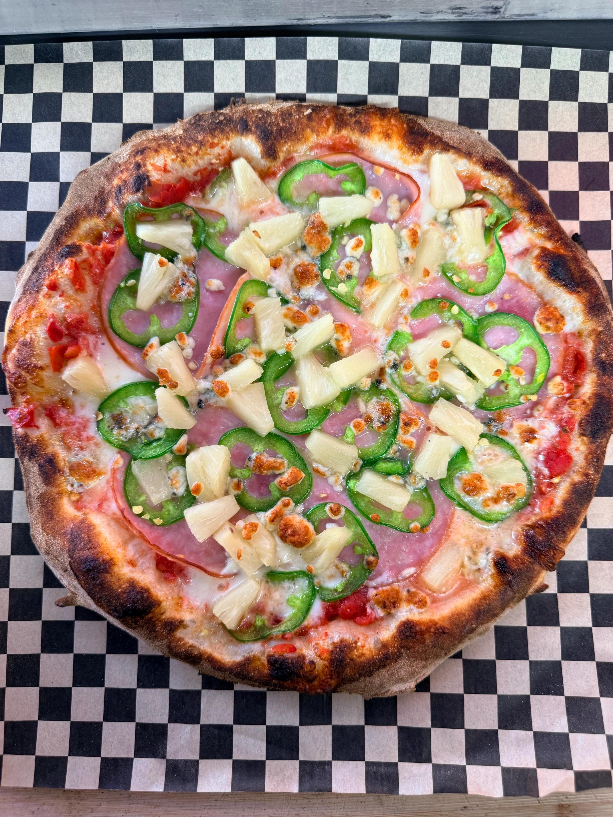 Hawaiian style pizza with jalapenos